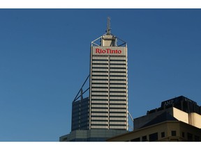Signage for Rio Tinto Ltd. is displayed atop the company's offices in the central business district of Perth, Australia, on Friday, Oct. 28, 2016. Australian bonds tumbled, sending 10-year yields up by the most in more than three years and adding to a global debt-market selloff that followed the shock election of Donald Trump as U.S. president. Photographer: Brendon Thorne/Bloomberg