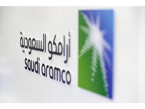 A Saudi Aramco logo sits on display during the Abu Dhabi International Petroleum Exhibition & Conference (ADIPEC) in Abu Dhabi, United Arab Emirates, on Tuesday, Nov. 13, 2018. OPEC's secretary-general, energy ministers from Saudi Arabia to Russia, CEOs at oil majors from Total SA, BP Plc and Eni SpA, and officials from Middle Eastern energy giants such as Abu Dhabi's Adnoc have gathered to sign deals and discuss oil, gas, refining and petrochemical issues. Photographer: Christopher Pike/Bloomberg