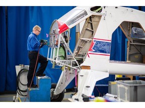 A worker disassembles a de Havilland Canada Beaver aircraft at the Viking Air Ltd. manufacturing facility in Victoria, British Columbia, Canada, on Wednesday, Nov. 14, 2018. Closely held Longview Aviation Capital Corp., parent company to Viking Air Ltd., is poised to become North America's largest maker of turboprop aircraft with its $300 million purchase of Bombardier's Dash 8 program, including the Q400. Photographer: James MacDonald/Bloomberg