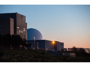 Sizewell A, left, and B, right, nuclear power stations, operated by Electricite de France SA (EDF), stand in Sizewell, U.K., on Friday, May 15, 2020. The network operator struck a deal with EDF to cut supply at its Sizewell nuclear plant by half for at least six weeks because the demand for power is 20% lower than normal as measures to contain the coronavirus have shut industry and kept people at home for weeks.