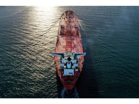 In this aerial drone view from a drone, a petroleum tanker ship passes through the Aransas Channel from the Gulf of Mexico enroute to the Port of Corpus Christi on May 27, 2020 in Port Aransas, Texas. The channel and port are currently being expanded to accommodate VLCCs (very large crude carriers) which will allow larger ships, capable of carrying a greater amount and wider variety of goods, to access the port.
