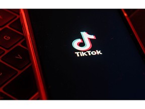 The logo for ByteDance Ltd.'s TikTok app is arranged for a photograph on a smartphone in Hong Kong. Photographer: Lam Yik/Bloomberg