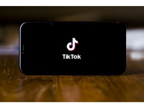 The logo for ByteDance Ltd.'s TikTok app is arranged for a photograph on a smartphone in Sydney, New South Wales, Australia, on Monday, Sept. 14, 2020. Oracle Corp. is the winning bidder for a deal with TikTok's U.S. operations, people familiar with the talks said, after main rival Microsoft Corp. announced its offer for the video app was rejected. Photographer: Brent Lewin/Bloomberg