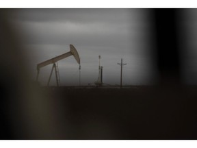 A horizontal drilling rig and a pump jack sit on federal land in Lea County, New Mexico, U.S., on Thursday, Sept. 10, 2020. With the U.S. oil industry reeling from the collapse in demand this year, the New Mexico shale patch has emerged as the go-to spot for drillers desperate to squeeze as much crude from the ground without bleeding cash. There's just one problem: Joe Biden wants to ban new fracking there. Photographer: Callaghan O'Hare/Bloomberg