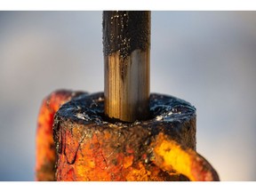 Thick black oil on the shaft of a pumping jack, also known as a "nodding donkey" in an oilfield near Dyurtyuli, in the Republic of Bashkortostan, Russia, on Thursday, Nov. 19, 2020. The flaring coronavirus outbreak will be a key issue for OPEC+ when it meets at the end of the month to decide on whether to delay a planned easing of cuts early next year. Photographer: Andrey Rudakov/Bloomberg