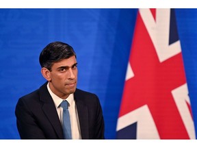 LONDON, ENGLAND - FEBRUARY 03: Britain's Chancellor of the Exchequer Rishi Sunak hosts a press conference in the Downing Street Briefing Room on February 3, 2022 in London, England. As the energy regulator, OFGEM, announced a domestic energy price cap rise of 54 percent earlier today, the Chancellor of the Exchequer announced the Energy Bill Rebate to help ease the cost of living burden. Council tax rebates of £150 for 80% of households and £200 off energy bills in October form £9.1 billion treasury package of support.