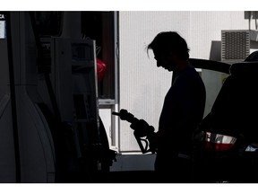 A driver holds a fuel nozzle at a Shell gas station in San Francisco, California, U.S., on Monday, March 7, 2022. The average price of gasoline in the U.S. jumped above $4 a gallon for the first time since 2008 in a clear sign of the energy inflation that's hurt consumers since Russia invaded Ukraine. Photographer: David Paul Morris/Bloomberg