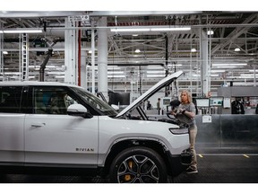 A Rivian R1T electric vehicle (EV) pickup truck on the assembly line at the company's manufacturing facility in Normal, Illinois, US., on Monday, April 11, 2022. Rivian Automotive Inc. produced 2,553 vehicles in the first quarter as the maker of plug-in trucks contended with a snarled supply chain and pandemic challenges. Photographer: Jamie Kelter Davis/Bloomberg
