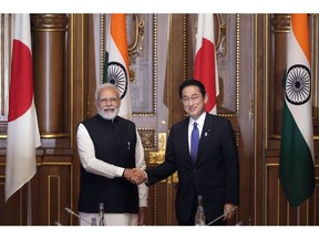 Fumio Kishida, Japan's prime minister, right, and Narendra Modi, India's prime minister, during their bilateral meeting in Tokyo, Japan, on Tuesday, May 24, 2022.  Photographer: Franck Robichon/EPA/Bloomberg