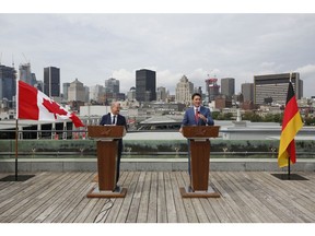 Olaf Scholz and Justin Trudeau speak during a news conference in Montreal on Aug. 22, 2022. Photographer: David Kawai/Bloomberg