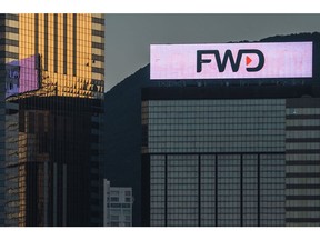 A digital billboard for FWD Group Holdings Ltd. atop a building in Hong Kong, China, on Saturday, Oct. 15, 2022. Hong Kong wants to become an international center for virtual assets as the city seeks to bolster its status as a global financial hub following the disruptions caused by the pandemic.