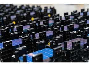 Stacks of solar cells at the Hanwha Q Cells solar cell and module manufacturing facility in Dalton, Georgia, US, on Thursday, Oct. 6, 2022. Once a stronghold of the conservative South, Georgia has emerged as both a hub of so-called cleantech manufacturing and a political swing state.