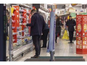 A shopper browses goods inside a J Sainsbury Plc supermarket in Guildford, UK, on Tuesday, Jan. 10, 2023. Sainsbury's are due to release a trading update on Wednesday.