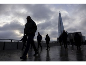 Commuters cross London Bridge in view of the Shard skyscraper in London, UK, on Monday, Jan. 16, 2023. The Office of National Statistics will release the latest labour market figures on Tuesday. Photographer: Jason Alden/Bloomberg