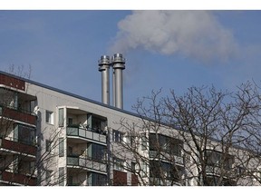 BERLIN, GERMANY - FEBRUARY 07: Vapor rises from the chimney of a natural gas-powered thermal power station behind a residential apartment building on February 07, 2023 in Berlin, Germany. Natural gas prices have fallen back to their level from before Russia's war in Ukraine, though savings have not yet reached consumers.