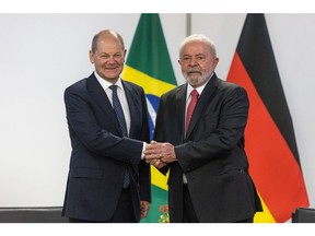 Brazil's President Luiz Inacio Lula da Silva, right, greets Germany's Chancellor Olaf Scholz in Brasilia on Jan. 30, 2023.