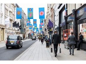 Pedestrians pass luxury stores on New Bond Street in central London, UK, on Thursday, Feb. 16, 2023. The UK's inflation rate slowed for a third month but remained stubbornly in double digits five times above the Bank of England's targeted level. Photographer: Betty Laura Zapata/Bloomberg