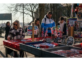 Shoppers browse souvenirs for sale from a stall on Walthamstow Market in London, UK, on Tuesday, Feb. 14, 2023. The Office for National Statistics are due to release the latest UK CPI Inflation data on Wednesday.