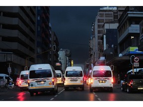 Taxis drive down on Bree street, one of the busy roads in city centre on a dark load shedding night in Johannesburg on 15, February Photo: Leon Sadiki