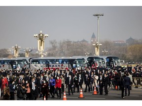 Delegates arrive at the Great Hall of the People before the opening of the first session of the 14th Chinese People's Political Consultative Conference (CPPCC) on March 4. Photographer: Lintao Zhang/Getty Images