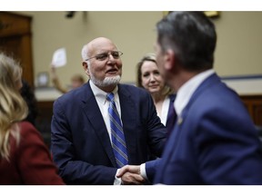 Robert Redfield, former director of the Centers for Disease Control and Prevention (CDC), center, speaks with Representative Ronny Jackson, a Republican from Texas, after a House Select Subcommittee on the Coronavirus Pandemic hearing in Washington, DC, US, on Wednesday, March 8, 2023. House Republicans are continuing to dig into the origins of the coronavirus with lawmakers planning to vote on whether to declassify intelligence on where the virus came from.