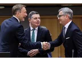 Christian Lindner, Germany's finance minister, left, Paschal Donohoe, president of the Eurogroup, center, and Magnus Brunner, Austria's finance minister, during a Eurogroup meeting at the European Council headquarters in Brussels, Belgium, on Monday, March 13, 2023. European Union finance ministers will emphasize the role governments have in reining in consumer price increases alongside the bloc's central bank, Donohoe said. Photographer: Valeria Mongelli/Bloomberg