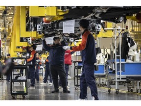 Workers on the production line of the Zhejiang Geely Holding Group Co. Preface sedan at the company's Hangzhou Bay No. 2 facility in Ningbo, China, on Wednesday, Feb. 22, 2023. Geely, one of China's largest carmakers, has joined a local price war by offering discounts of as much as 30,000 yuan ($4,350) on some of its models. Photographer: Qilai Shen/Bloomberg