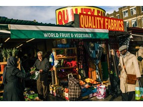 A grocer selling vegetables on Ridley Road Market in the Hackney district in London, UK, on Saturday, March 18, 2023. The Office for National Statistics are due to release the latest UK CPI Inflation data on Wednesday. Photographer: Jose Sarmento Matos/Bloomberg