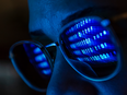 Computer code reflected in glasses