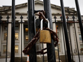 A lock is seen on a gate on the exterior of the U.S. Department of Treasury building as they joined other government financial institutions to bail out Silicon Valley Bank's account holders after it collapsed on March 13, 2023 in Washington, D.C.
