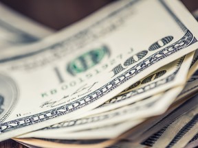 A stack of U.S. banknotes.