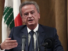 FILE - Riad Salameh, the governor of Lebanon's Central Bank, speaks during a press conference, in Beirut, Lebanon, Nov. 11, 2019. A Lebanese judge on Thursday, Feb. 23, 2023 charged the cash-strapped country's central bank governor, his brother, and an associate with corruption, two judicial officials said. Lebanon since 2019 has been in the throes of the worst economic and financial crisis in its modern history, rooted in decades of corruption and mismanagement.