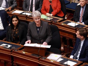 Finance Minister Katrine Conroy presents her first budget as Premier David Eby looks on in the legislative assembly at legislature in Victoria, Tuesday, Feb. 28, 2023.