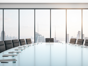 Corporate boardroom with skyline view