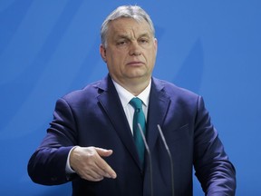 FILE - Hungary's Prime Minister Victor Orban briefs the media in Berlin, Germany, Monday, Feb. 10, 2020. Orban on Tuesday, Feb. 28, 2023, thanked Egypt for its role in capping Europe-bound migration as the two countries inked a series of preliminary agreements in Cairo.