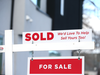 Sold sign on home