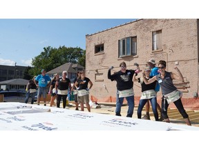 CNH Industrial employees representing the CASE Construction Equipment brand while volunteering with Habitat for Humanity