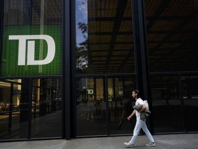 A man walks past the TD Bank in the Bay Street Financial District in Toronto on Friday, August 5, 2022.&ampnbsp;TD Bank Group has raised questions about the chances of it closing its proposed US$13.4-billion acquisition of First Horizon by looking to further extend the closing window.