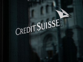 A sign of Credit Suisse bank is seen on the branch building in Geneva.