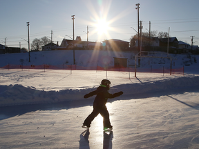 Sun silhouettes a child skating