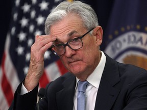 Federal Reserve Board Chair Jerome Powell answers questions at the news conference after the March 22 meeting.