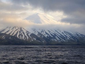 FILE - This photo provided by the Alaska Volcano Observatory/U.S. Geological Survey shows the Tanaga Volcano near Adak, Alaska, on May 23, 2021. A swarm of earthquakes occurring since late February 2023 has intensified at the remote Alaska volcano dormant for over a century, a possible indication of an impending eruption.