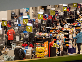 Shoppers at grocery story check out