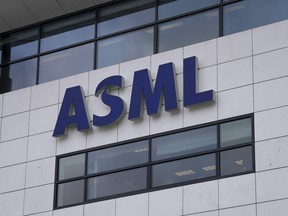 FILE - the logo of ASML, a leading maker of semiconductor production equipment, hangs on the head office in Veldhoven, Netherlands, Monday, Jan. 30, 2023. The Dutch government announced Tuesday that it is planning on imposing additional restrictions on the export of machines that make advanced processor chips, joining a U.S. initiative that aims at restricting China's access to materials used to make such chips. Dutch Minister for Foreign Trade and Development Cooperation Liesje Schreinemacher sent a letter to lawmakers outlining the proposed limitations, which come in addition to existing export controls on semiconductor technology.