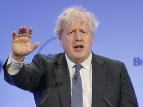 Former British Prime Minister Boris Johnson speaks during the Global Soft Power Summit, at the Queen Elizabeth II Conference Centre in London, Thursday March 2, 2023. Johnson on Thursday poured cold water on current premier Rishi Sunak's new Brexit deal with the European Union, saying he would "find it hard" to vote for it in Parliament.