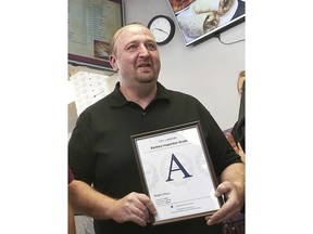 Stavros Papantoniadis, owner of Stash's Pizza, a Boston sanitary grade certificate after inspection by the Health Division of the Inspectional Services Department on Nov 2, 2016, in Boston. Papantoniadis, accused by federal authorities of abusing employees who were not legally in the U.S., has been ordered Tuesday, March 21, 2023, held without bail by a magistrate judge who cited the defendant's "history of violence and threats." Papantoniadis, 47, who also goes by Steve, faces one charge of forced labor but allegedly victimized at least seven employees, according to court documents.
