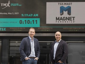 Magnet Forensics chief executive Adam Belsher, left, and founder and chief technology officer Jad Saliba outside of the TSX building on Toronto's Adelaide Street where their company went public with an IPO.