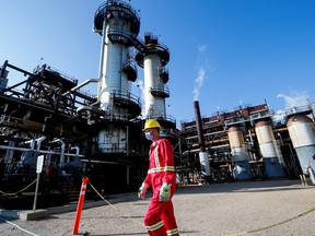 A Shell employee walking past the company's Quest Carbon Capture and Storage facility in Fort Saskatchewan, Alta.