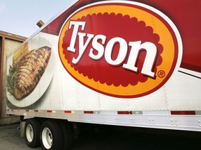 FILE - A Tyson Foods, Inc., truck is parked at a food warehouse on Oct. 28, 2009, in Little Rock, Ark. Thirty-four Tyson Foods employees, former employees and family members filed a lawsuit against the Arkansas-based company Monday, March 6, 2023, saying it failed to take appropriate precautions during the early days of the COVID pandemic.