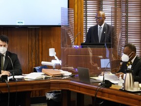 FILE - Attorney Terry Clayton, center, speaks during a hearing in Davidson County Chancery Court on April 6, 2022, in Nashville, Tenn. Clayton is representing town leaders of Mason, Tenn., a small town facing a takeover of its finances by the state comptroller. Two employees of the rural Tennessee town that resisted the takeover after Ford Motor Co. announced plans to build an electric truck plant nearby have been charged with the theft of town funds and official misconduct, officials said Wednesday, March 22, 2023.